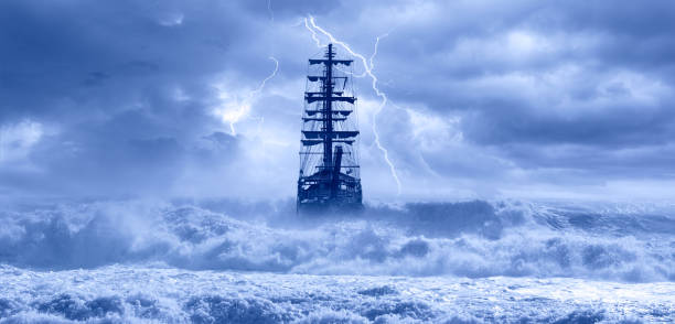 istock Sailing old ship in storm sea on the background heavy clouds with lightning 1742320702