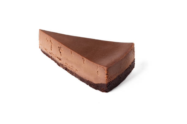 Slice of chocolate cheesecake on white background isolated top view