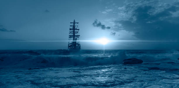 istock Sailing old ship in storm sea on the background heavy clouds with lightning 1742322491