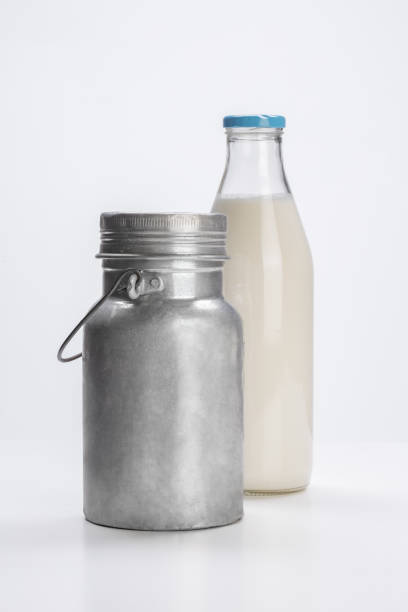 istock milk glass bottle and can, on white background 1742323563