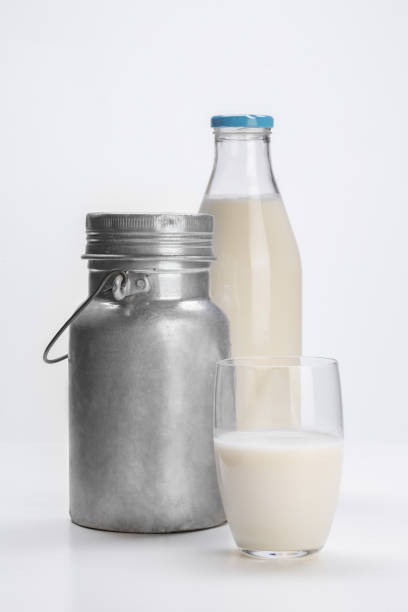 istock milk in glass cup, bottle, tin on white background 1742323657