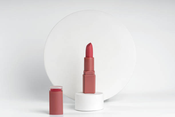istock A sample of red lipstick standing on a white podium presenting demonstration product 1742323700
