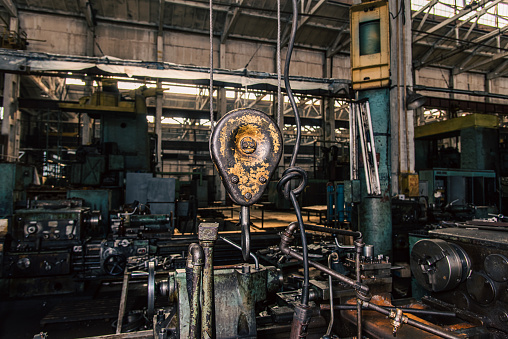 Old equipment, machines, tools in a rustic style in an abandoned mechanical factory