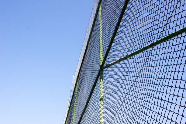 istock Football field surrounded by net 1742335503