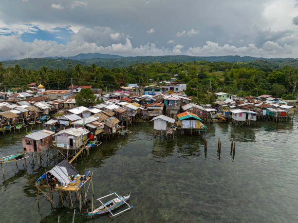 Fishermen village in Zamboanga. Philippines. Aerial view boats beside houses located by the water in Zamboanga raised on stilts. Mindanao, Philippines. zamboanga del sur stock pictures, royalty-free photos & images