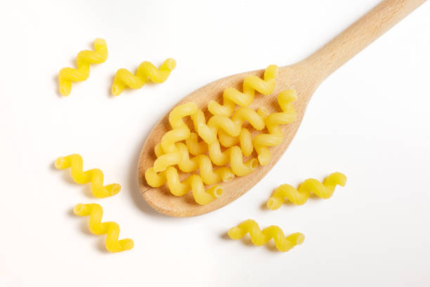 istock durum wheat pasta on wooden spoon 1742350344