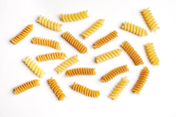 istock raw durum wheat and wholemeal pasta on a white background with a view from above 1742354445