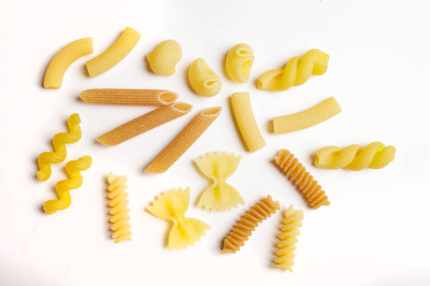 istock raw durum wheat and wholemeal pasta on a white background with a view from above 1742354447