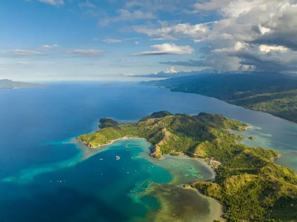 Tropical landscape of verdant forest of sleeping dinosaur island in Mati, Davao Oriental. Philippines.