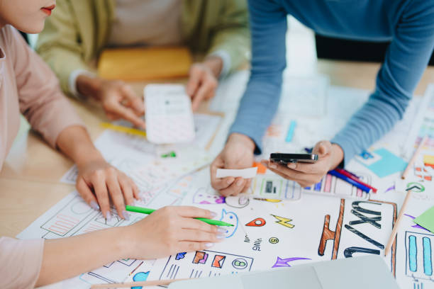 istock Team of Creative Web, Graphic Designer planning for mobile phone, drawing website ux ui app for mobile phone application and development template layout, process to developing prototype wireframe. 1742360841