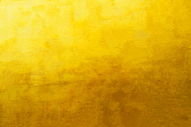 istock Old glod metal wall background or texture and shadow 1742362491