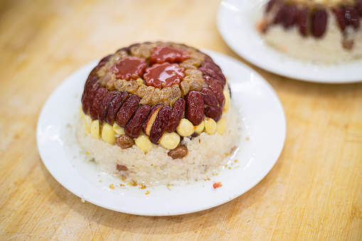 Make traditional Chinese traditional steamed cake. Red date glutinous rice cake.