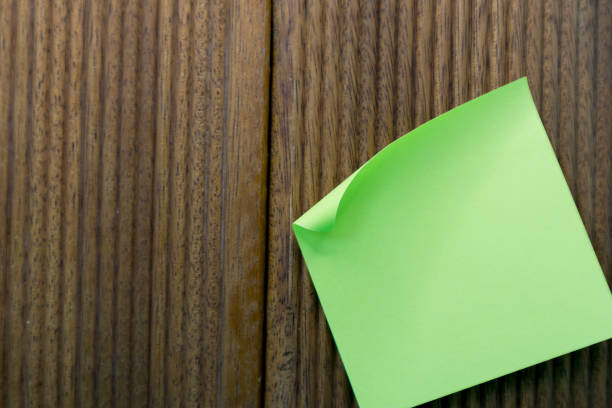istock sticky notes on wooden background with striated texture 1742379306