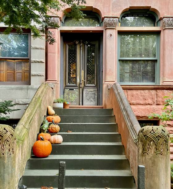 istock New York City brownstone stoop decorated with pumpkins in the fall 1742380845