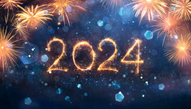 istock 2024 - New Year Celebration With Sparkler And Fireworks At Night 1742381982