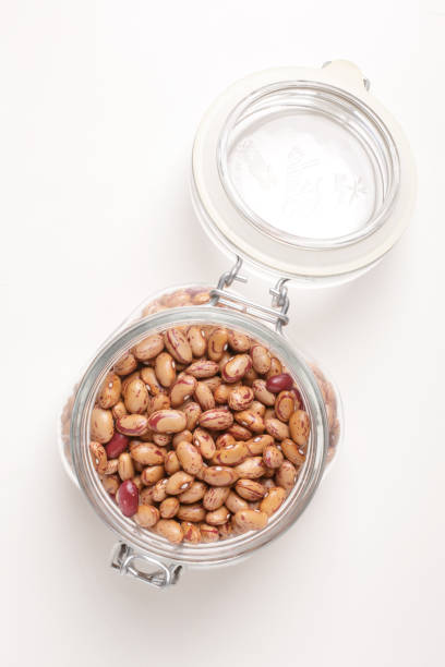 istock borlotti beans inside a glass jar on a white background with a top view 1742392941
