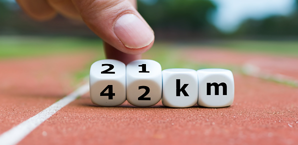 Dice form the expression '21 km' and '42 km'. Symbol for the distance of a half or a full marathon.