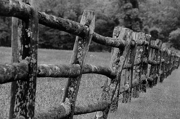 istock Leaning farm fence with barbed wire 174239937