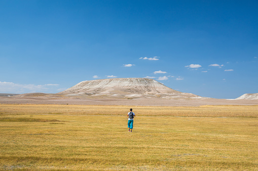 One backpacker on a steppe.
