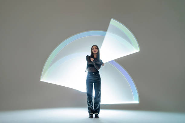 istock Young woman in front of a light shape 1742405987