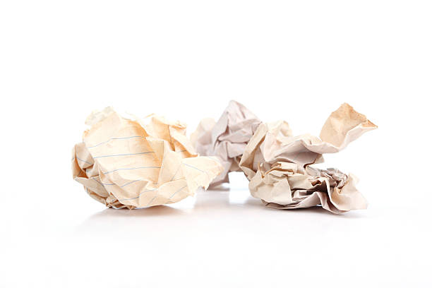 istock Three of crumpled old paper balls on white background 174240925