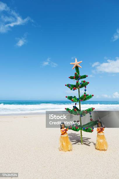 Christmas Tree And Hula Dancers In Tropical Hawaiian Beach Vt Stock Photo - Download Image Now