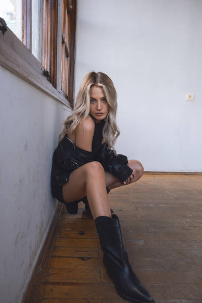 Young fashion blond woman wearing leather jacket.