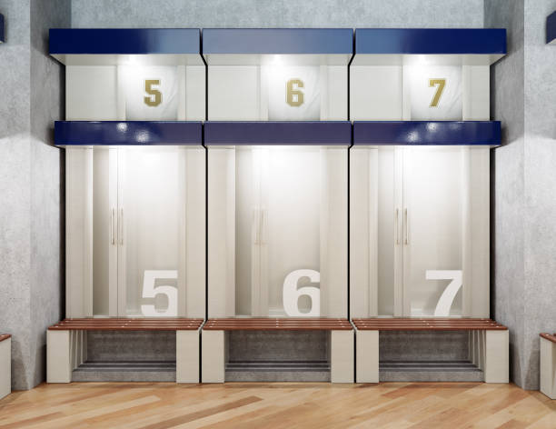 A sports locker room made of cubicles with cupboards numbered shirts a wooden bench and flooring - 3D render