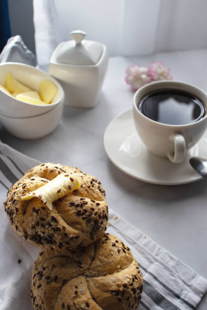 Breakfast of coffee and breads on the dining table