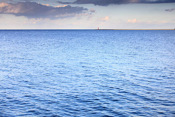 istock cloudy blue sky leaving for horizon surface sea 174242991