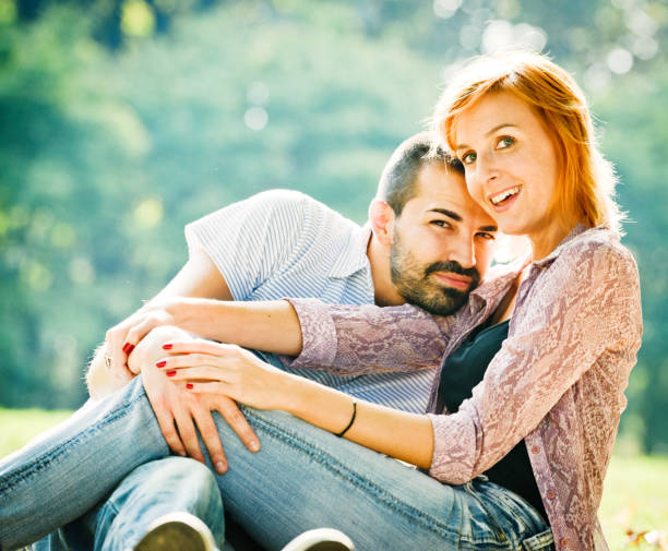 istock Happy Beautiful couple having fun in the park 174243296