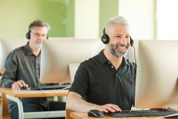 istock Mature men in call center 1742438110