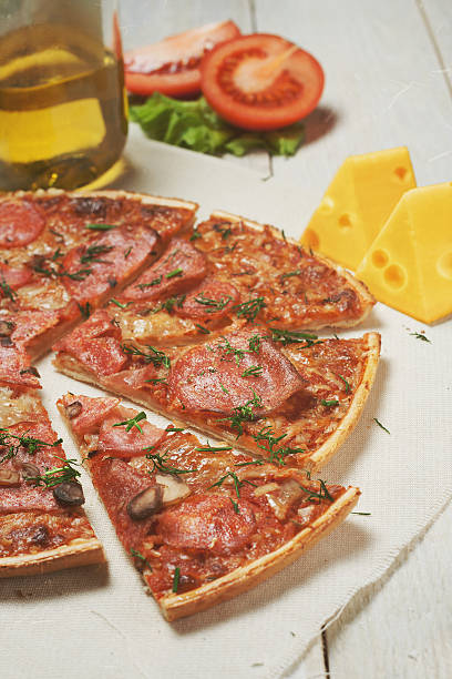 pizza with sausage and mushrooms stock photo