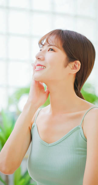 istock asian woman touch her face 1742457171