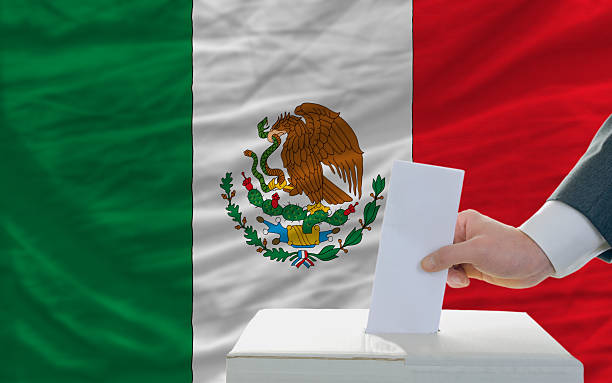 istock man voting on elections in mexico front of flag 174245730