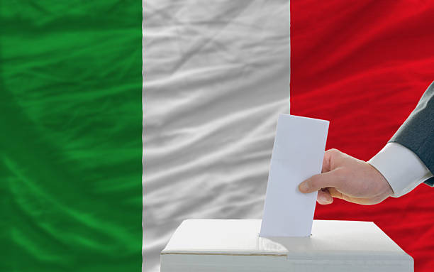 istock man voting on elections in italy front of flag 174246054