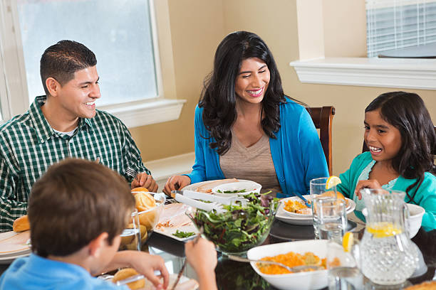istock Happy family having dinner together at dining room table 174246174