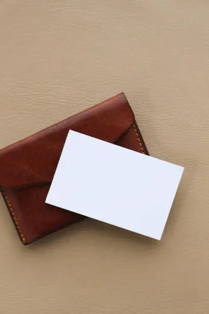 blank business card with leather card case on the table