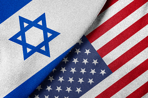 United States and Israel flags together with textile cloth fabric texture