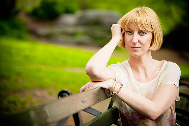 istock Pensive mature woman relaxing in park 174250277