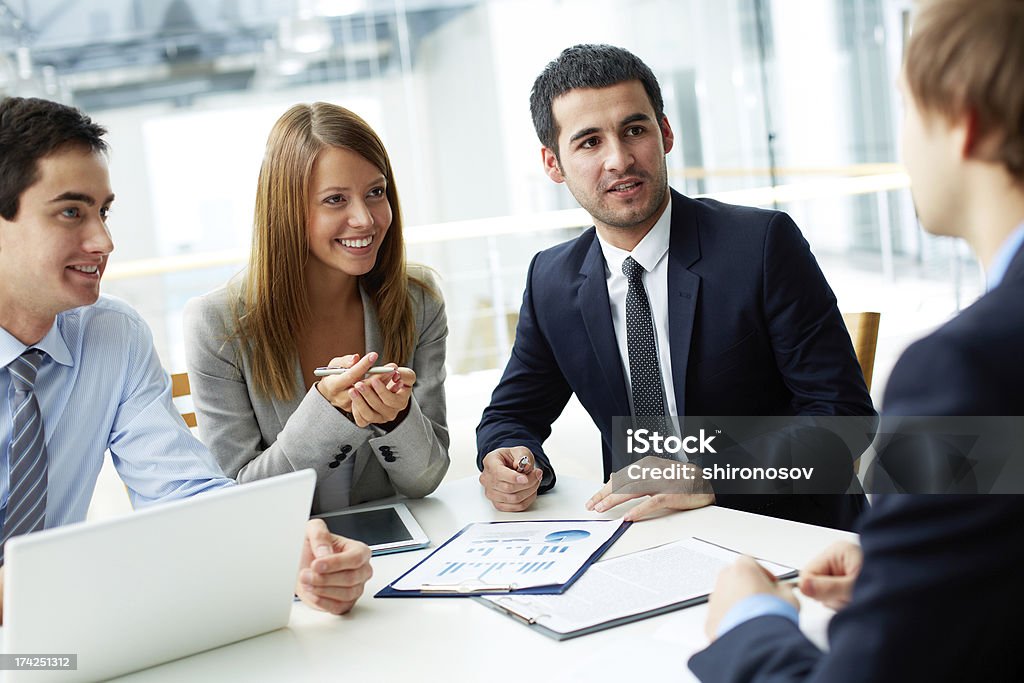 Meeting Image of business partners discussing documents and ideas at meeting Adult Stock Photo