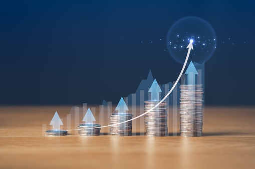 coin stack with arrow for Investment Strategies and Financial Growth.Saving Money and Achieving Financial Goals concept.