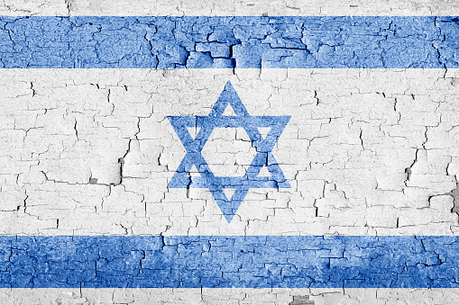 Israel flag on old cracked wall texture