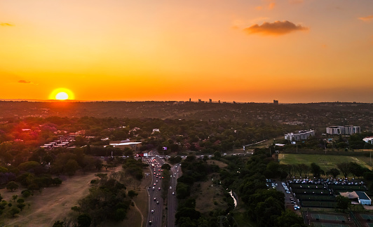 Sandton Drive sunset intersection with Winnie Madikizela-Mandela Drive with Randburg in the distance.