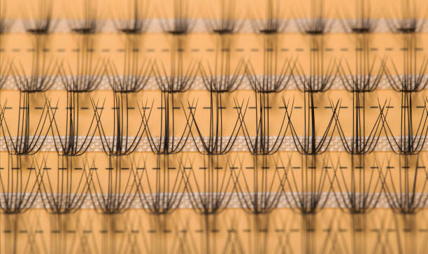 Modern set of false eyelashes for gluing. Women's cosmetics, close-up Modern set of false eyelashes for gluing. Women's cosmetics. clump eyelashes stock pictures, royalty-free photos & images