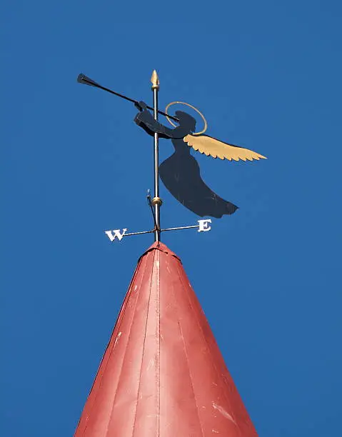 Wind vane in the form of an angel on the roof of the old town