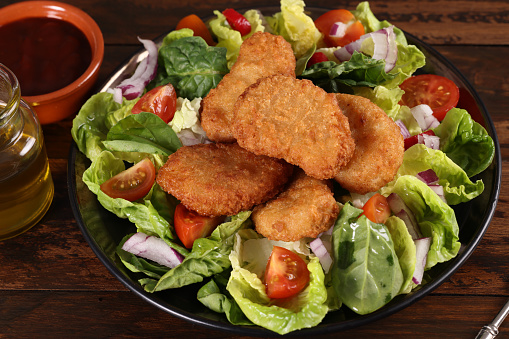 Chicken Nuggets on a salad