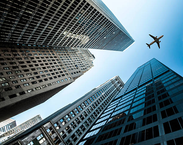 istock Jet Over Business Towers 174255484
