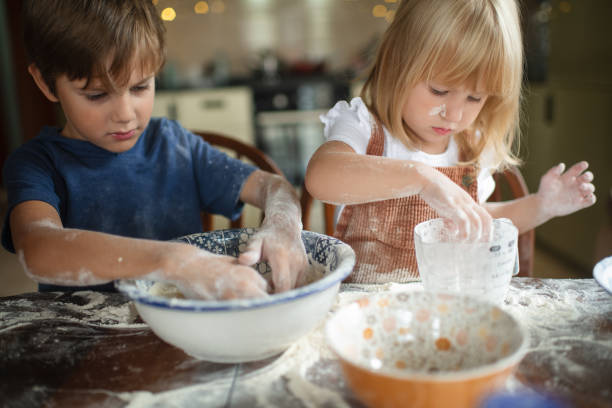istock Children making pizza at the kitchen 1742559791