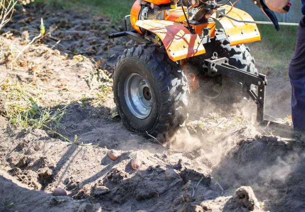 istock A summer resident plows a garden with potatoes with a walk-behind tractor in the fall during the harvest. Copy space for text 1742559912